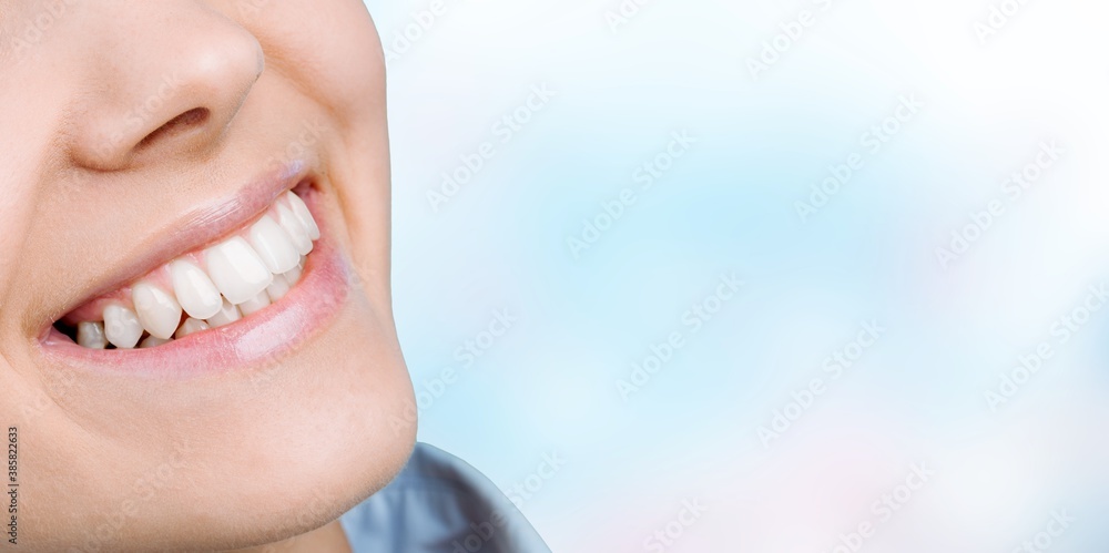 Obraz premium Beautiful smile of young woman with healthy white teeth
