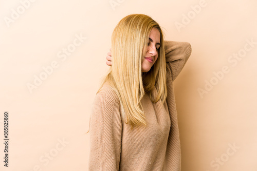 Young blonde caucasian woman suffering neck pain due to sedentary lifestyle. © Asier