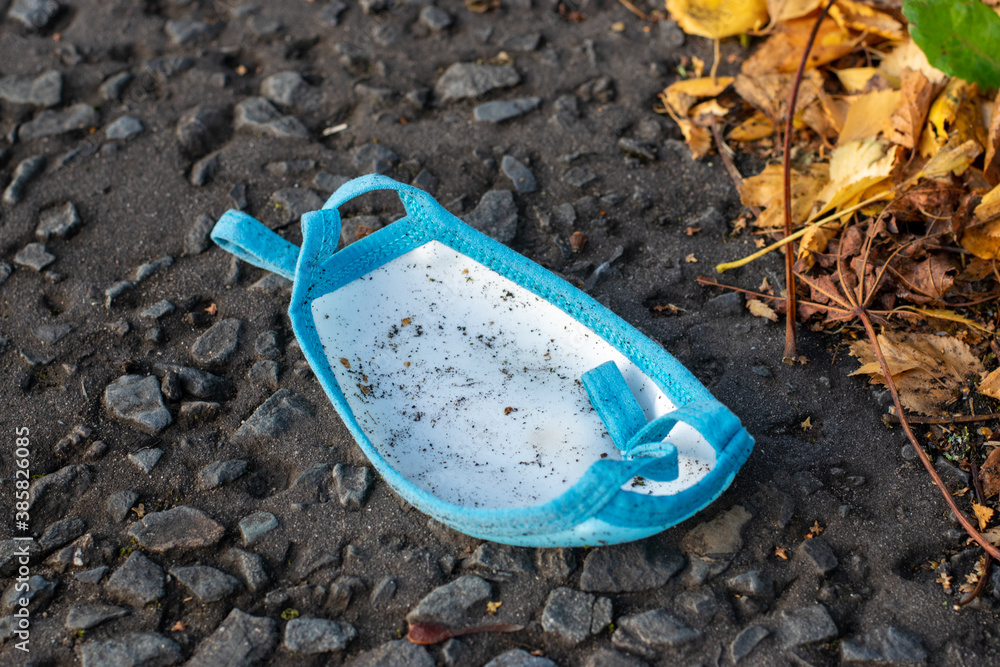 disposed used face mask on the road disposed used face mask on the road