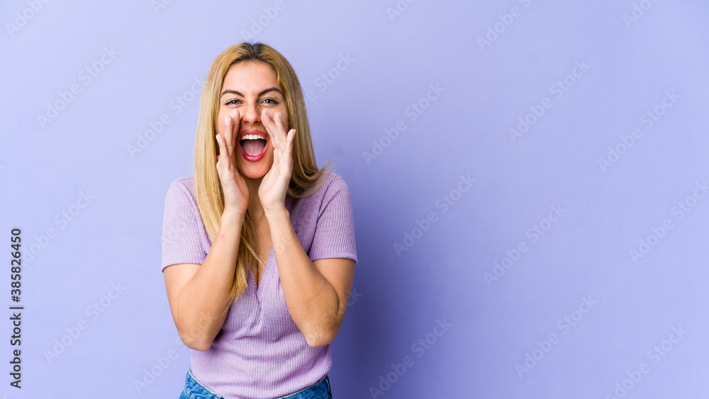 Young blonde caucasian woman shouting excited to front. Young blonde caucasian woman shouting excited to front.