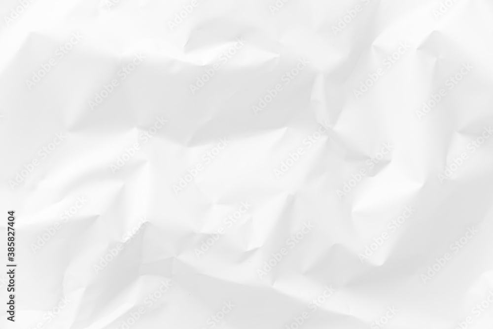 A clean, crumpled sheet of white or milky paper. Light texture of a crumpled paper sheet. Background, blank for design. High quality photo