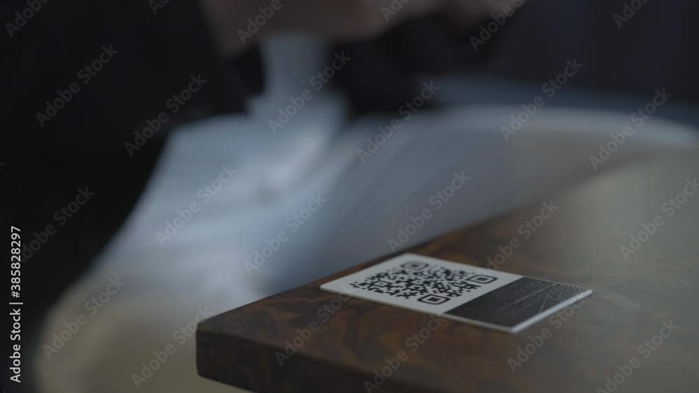 Unrecognizable Caucasian man scanning QR-code with smartphone. Male ...