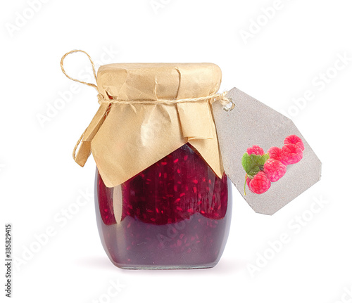 glass jar with raspberry jam on white background