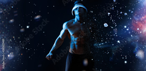 Muscular model sports young man in glasses of virtual reality on dark background. Fashion portrait of strong brutal guy. Sexy torso. Male flexing his muscles. VR.