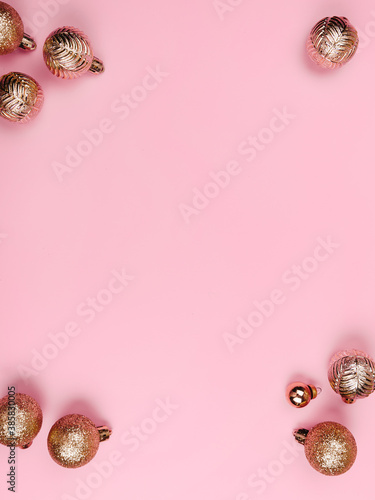 Christmas composition. White Gold decorations on pastel pink background. Christmas, winter, new year concept. Flat lay, top view, copy space.