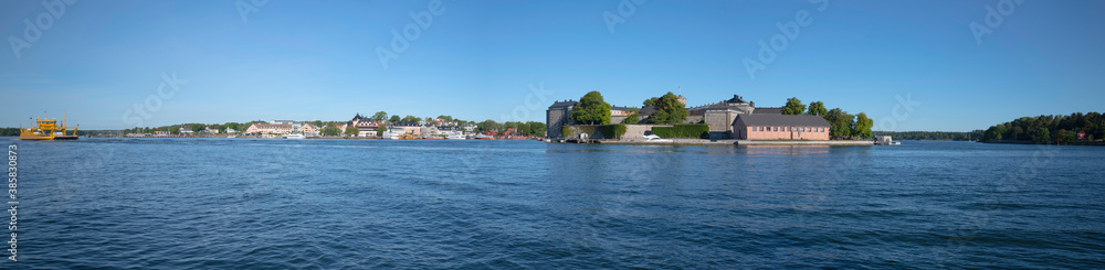 Panorama view over the islands Vaxön, Vaxholmen and Rindö. An old castle, car ferries and commuter boats to the Stockholm archipelago.