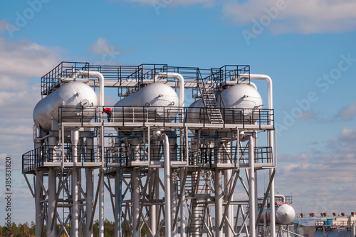 Industrial equipment at an oil refinery station.
Oil and gas industry, oil refining and refining photo