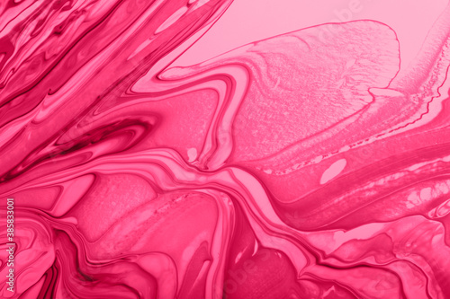 Monochrome pink marble background.Mixed nail polishes,make up concept.Beautiful stains of liquid nail laquers.Fluid art,pour painting technique.Horizontal banner,can be used as backdrop for chat.