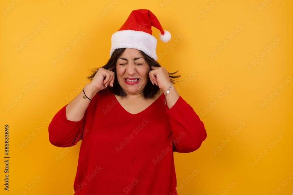 Stop making this annoying sound! Headshot of unhappy stressed out young female making worry face, plugging ears with fingers, irritated with loud noise coming from neighbours who live above her. Stop making this annoying sound! Headshot of unhappy stressed out young female making worry face, plugging ears with fingers, irritated with loud noise coming from neighbours who live above her.