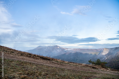 sunrise in the mountains with morning fog from early autumn