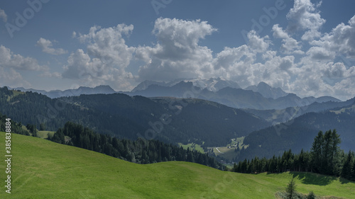 View of the magnificent Dolomite mountains as seen from Piz La Ila plateau above La Villa village in Badia valley, Dolomites, South Tirol, Italy. 