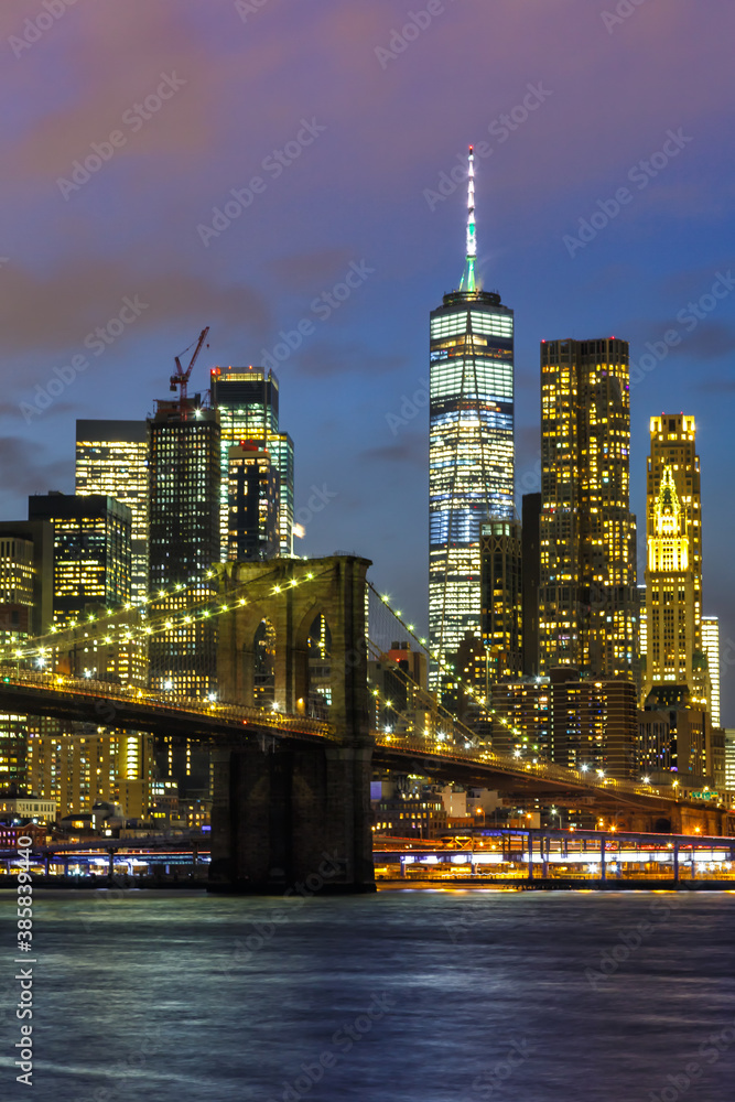 Obraz premium New York City skyline night Manhattan town Brooklyn Bridge World Trade Center portrait format