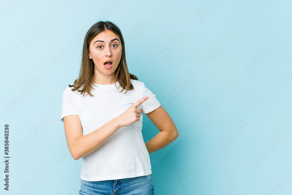 Young caucasian woman pointing to the side Young caucasian woman pointing to the side