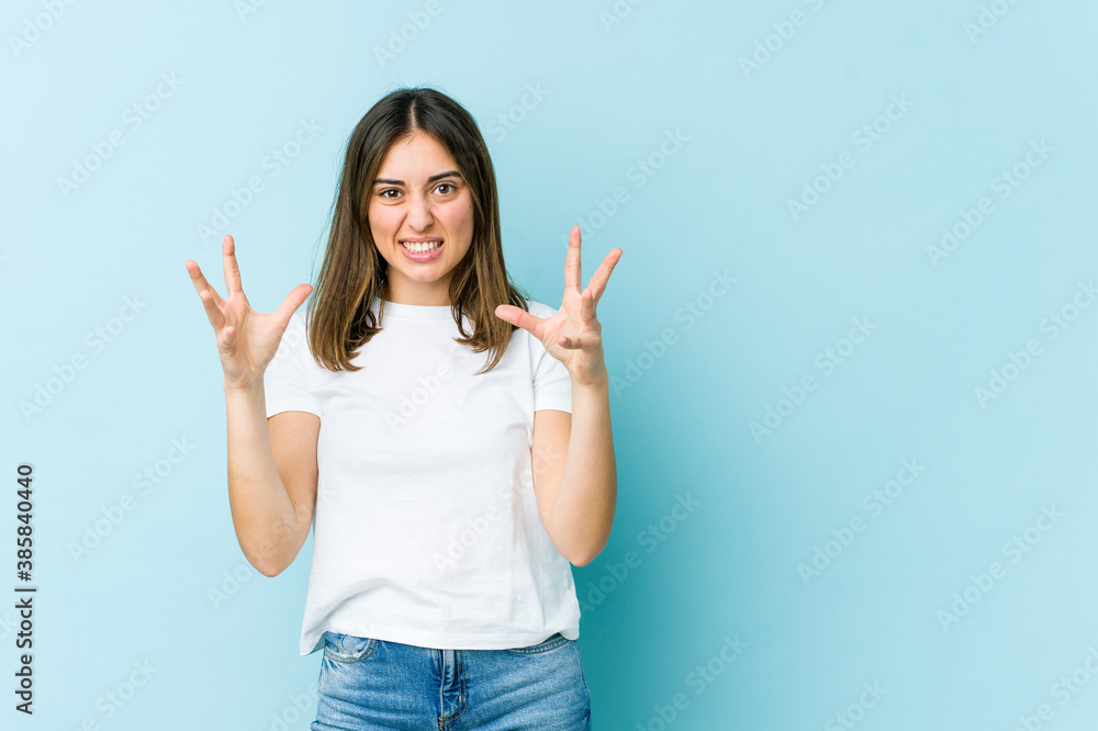 Young caucasian woman screaming with rage. Young caucasian woman screaming with rage.