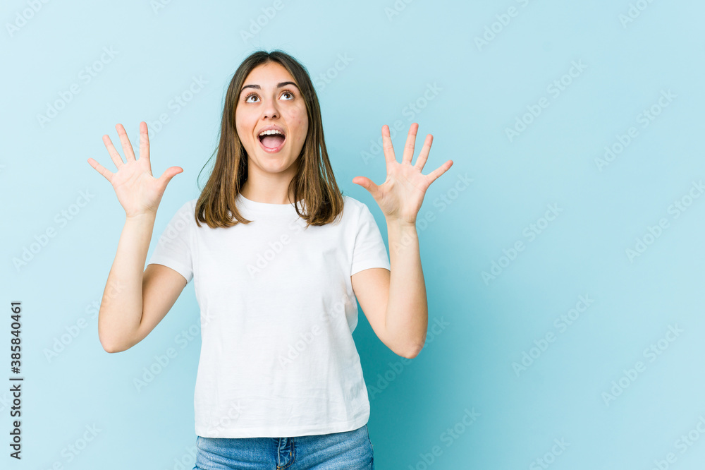 Young caucasian woman screaming to the sky, looking up, frustrated. Young caucasian woman screaming to the sky, looking up, frustrated.