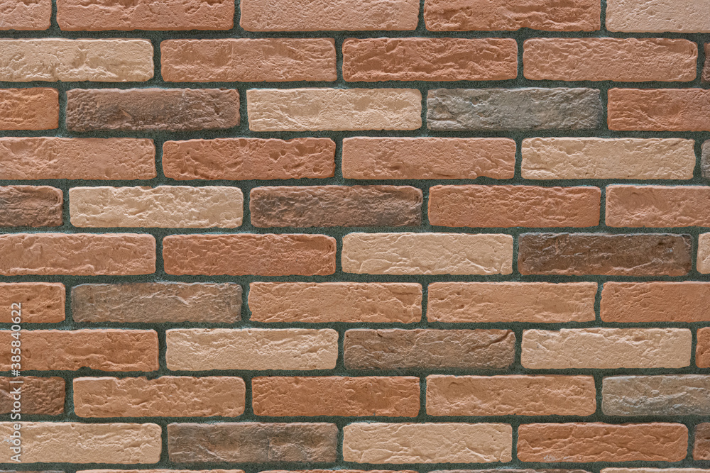 Fragment of a wall with tiles in the form of brickwork. Background. Texture. Fragment of a wall with tiles in the form of brickwork. Background. Texture.