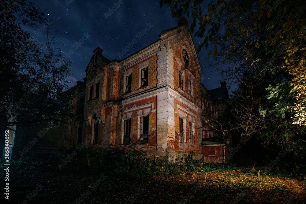 Dark and creepy old abandoned haunted mansion at night. Former Karl von Meck house Dark and creepy old abandoned haunted mansion at night. Former Karl von Meck house