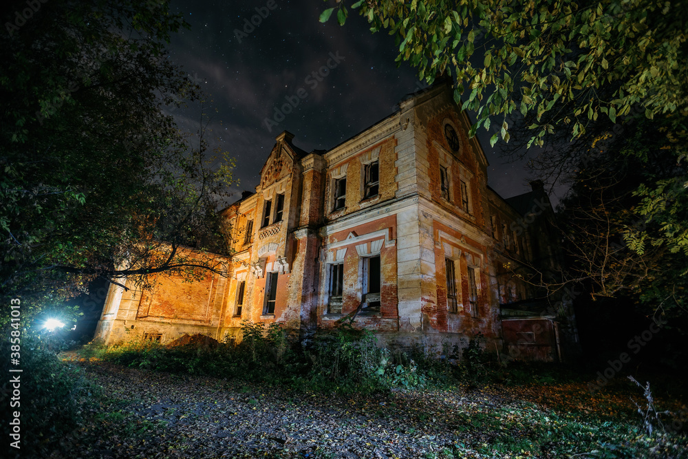 Dark and creepy old abandoned haunted mansion at night. Former Karl von Meck house Dark and creepy old abandoned haunted mansion at night. Former Karl von Meck house