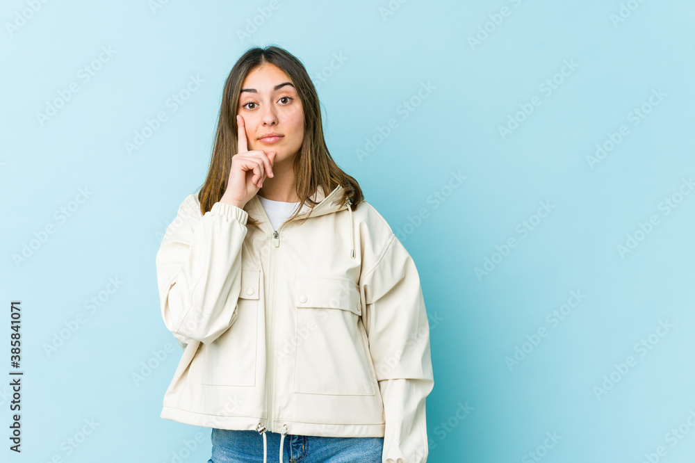 Young caucasian woman showing number one with finger. Young caucasian woman showing number one with finger.