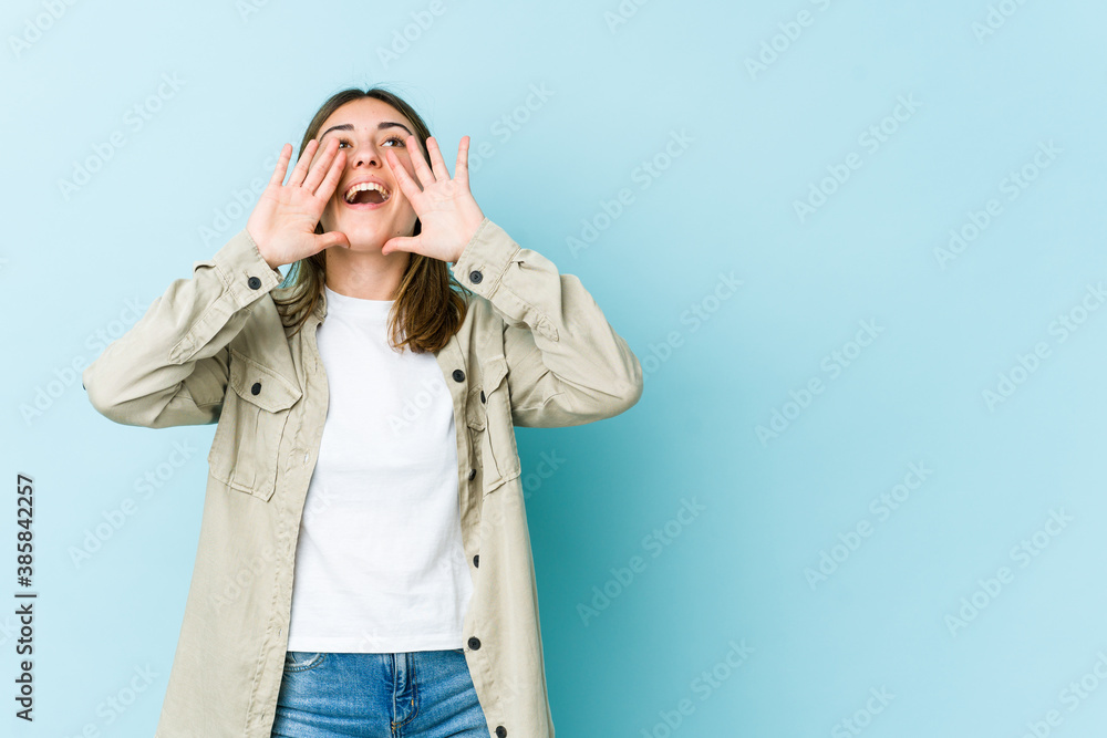 Young caucasian woman shouting excited to front. Young caucasian woman shouting excited to front.