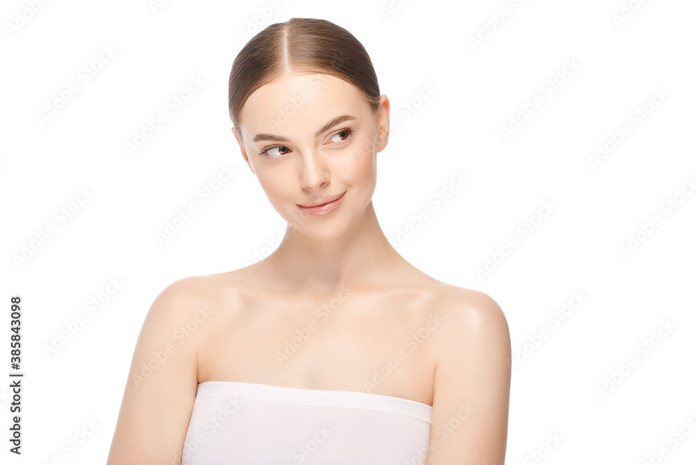 Portrait of young beautiful woman with tied hair after morning beauty routine looking right, isolated on white background Portrait of young beautiful woman with tied hair after morning beauty routine looking right, isolated on white background