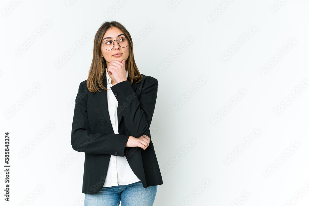 Young caucasian business woman looking sideways with doubtful and skeptical expression. Young caucasian business woman looking sideways with doubtful and skeptical expression.