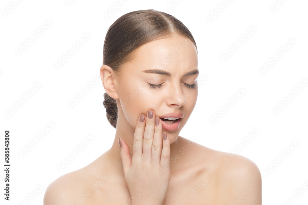 Young woman suffering from toothache, pressing hand to jaw trying to overcome tooth pain, isolated on white background Young woman suffering from toothache, pressing hand to jaw trying to overcome tooth pain, isolated on white background