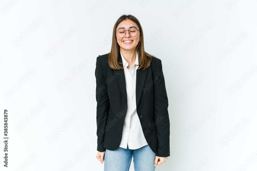 Young caucasian business woman laughs and closes eyes, feels relaxed and happy. Young caucasian business woman laughs and closes eyes, feels relaxed and happy.