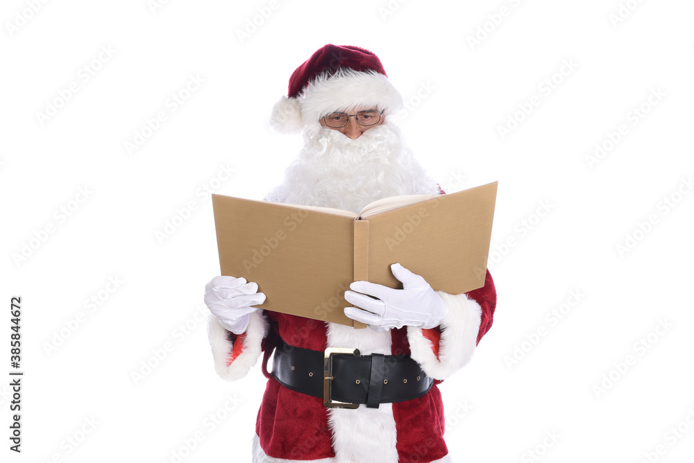 Senior man wearing a traditional Santa Claus costume holding his Naughty and Nice Book. Isolated on white.