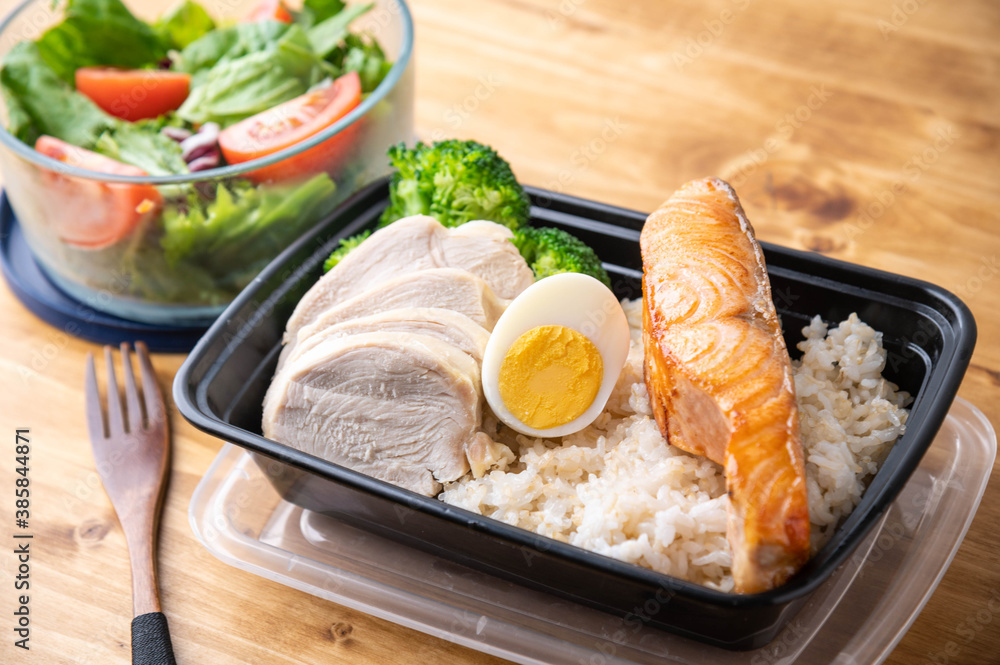 body building lunch box image with chicken breast, salmon and brown rice body building lunch box image with chicken breast, salmon and brown rice