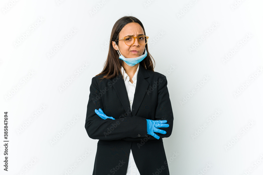 Young business latin woman wearing a mask to protect from covid isolated on white background unhappy looking in camera with sarcastic expression. Young business latin woman wearing a mask to protect from covid isolated on white background unhappy looking in camera with sarcastic expression.