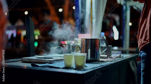 Acehnese barista manually pouring coffee in traditional method, also known as Kupi Sareng Aceh photo