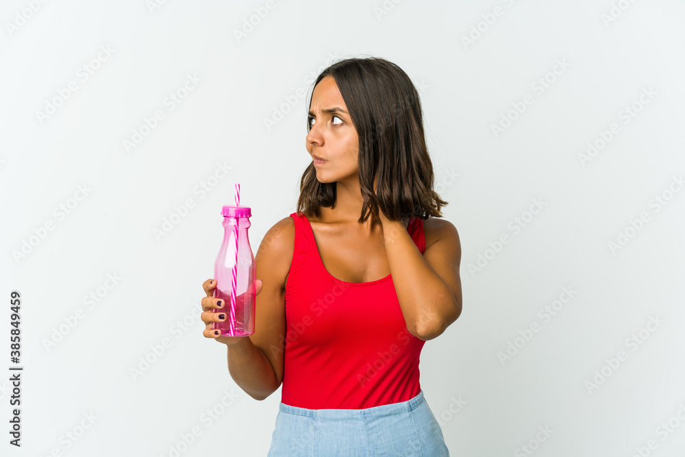 Young latin woman holding a milkshake isolated on white background Young latin woman holding a milkshake isolated on white background