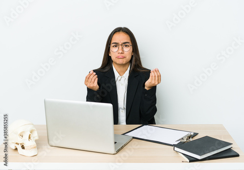 Young traumatologist asian woman isolated on white background showing that she has no money. © Asier
