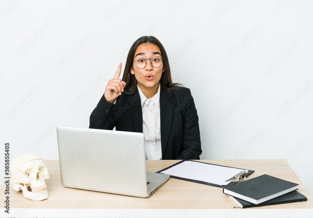 Young traumatologist asian woman isolated on white background having an idea, inspiration concept. Young traumatologist asian woman isolated on white background having an idea, inspiration concept.
