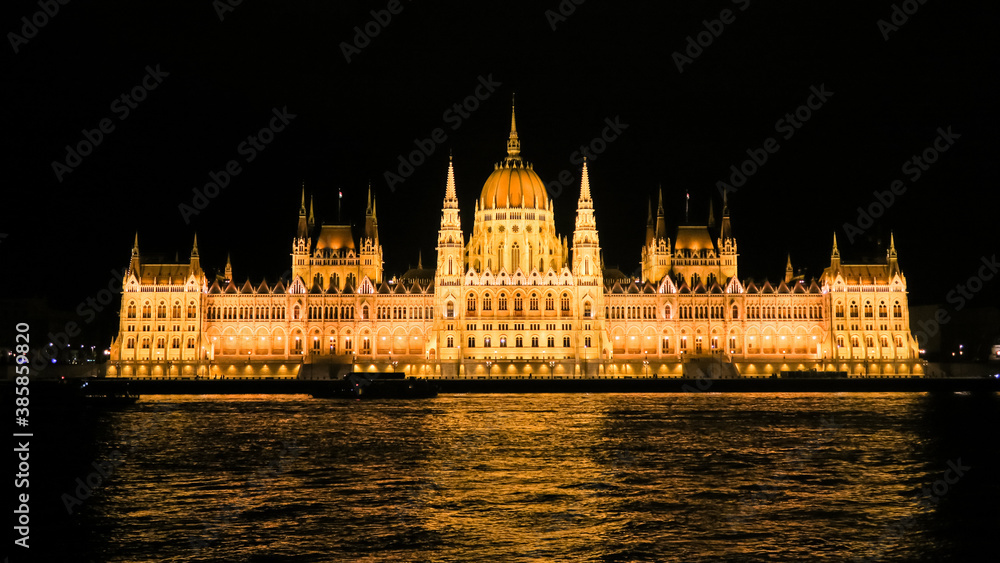 Budapest parliament building at night with reflect in the Danube river