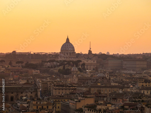 View of St Peter's basilica, as seen from Castel sant'Angelo, at golden hour, in Rome, Italy