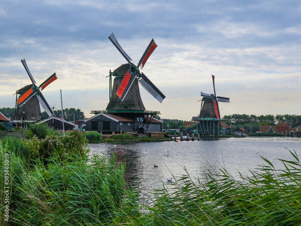 Fototapeta premium Historic windmills and houses at Zaanse Schans, Netherlands