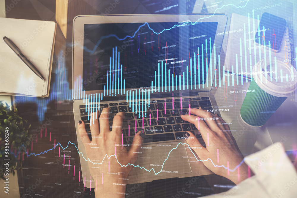 Double exposure of woman hands typing on computer and forex chart hologram drawing. Stock market invest concept. Double exposure of woman hands typing on computer and forex chart hologram drawing. Stock market invest concept.