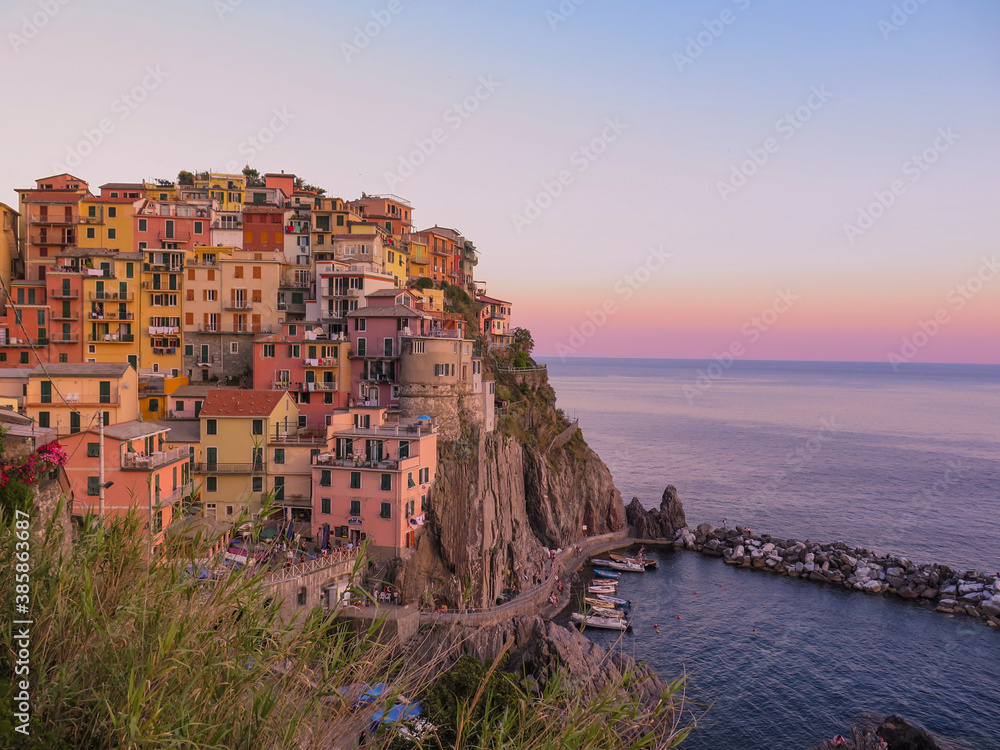 Beautiful view of Manarola, a colorful italian village in the Cinque Terre, during sunset