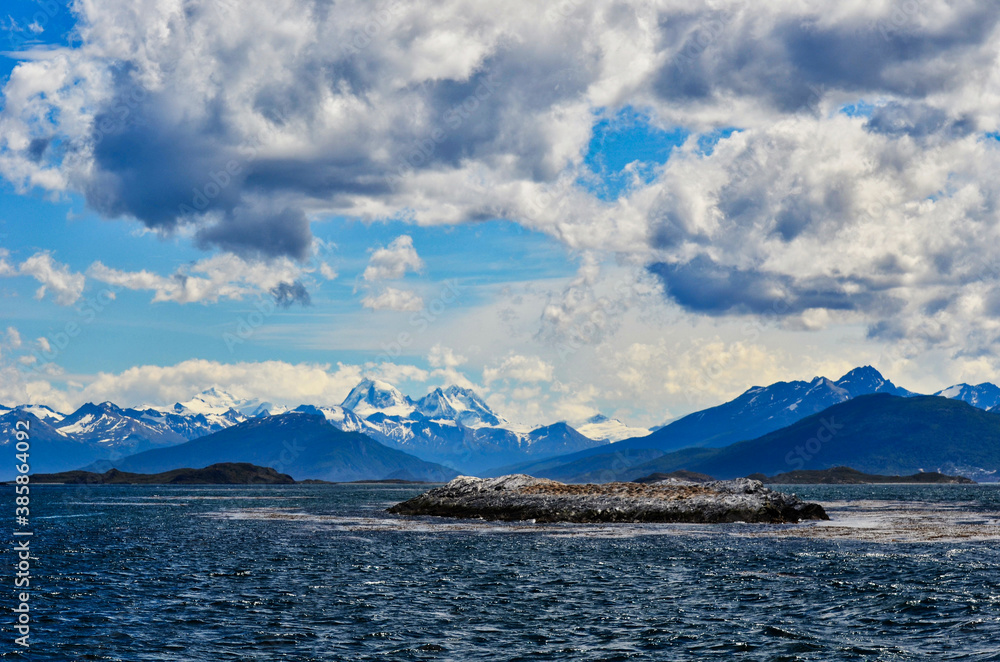 Bird Island Landscape of Beagle Channel in Argentina with Moutain Backdrop and Clouds