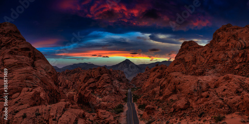 Valley of Fire State Park  Nevada  United States. Aerial panoramic view on the scenic road in the desert during a cloudy twilight. Dramatic Twilight Sky Artistic Render.