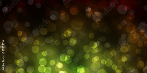 Dark Green, Yellow vector backdrop with dots.