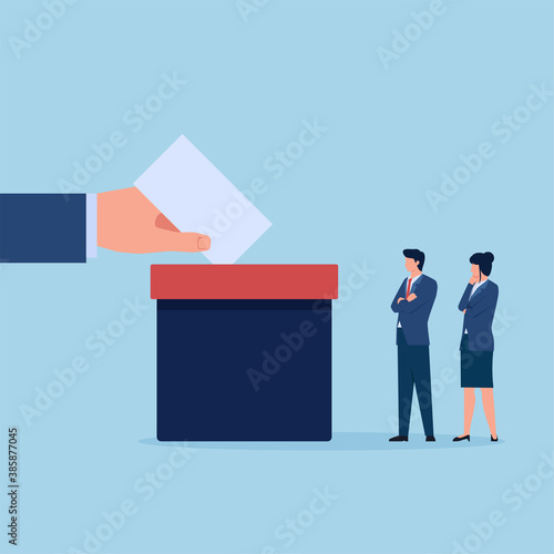 Hand put vote paper in to the box while people are queuing up.