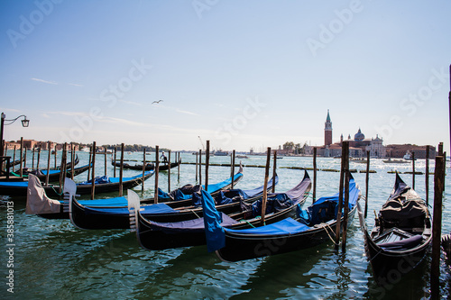 The famous gondolas parked in the harbour in Venice, Italy