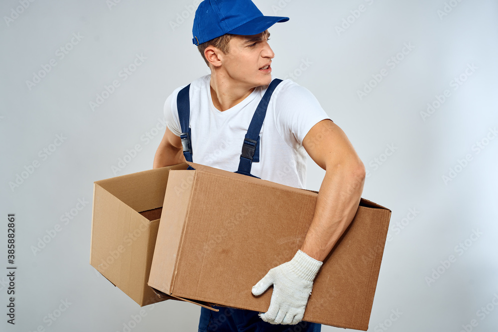 Man worker with box in hands delivery loading service packing service Man worker with box in hands delivery loading service packing service