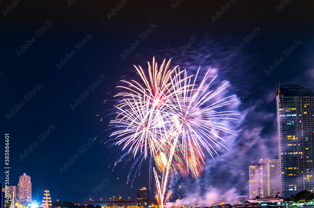 Firework display for celebration happy new year and merry christmas with Twilight night and firework lighting in bangkok cityscape, Thailand. Firework display for celebration happy new year and merry christmas with Twilight night and firework lighting in bangkok cityscape, Thailand.
