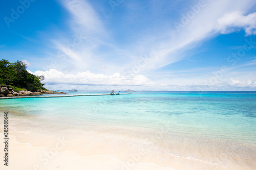 Nature and travel. Beach sea and blue sky with clouds background.