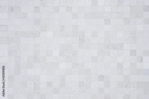 Closeup shot of tile mosaic white and gray pattern background.