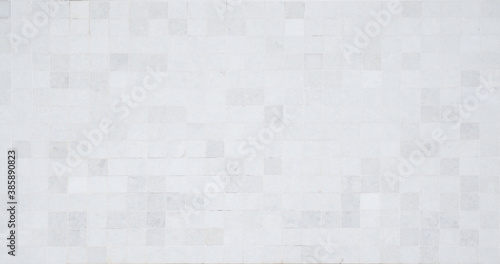 Closeup shot of tile mosaic white and gray pattern background.